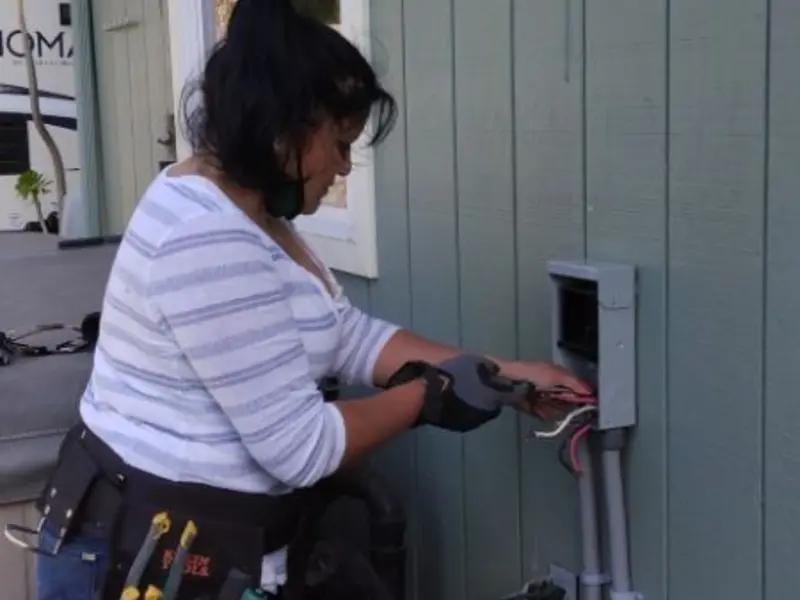 Licensed electrician wiring an exterior subpanel in Ottawa